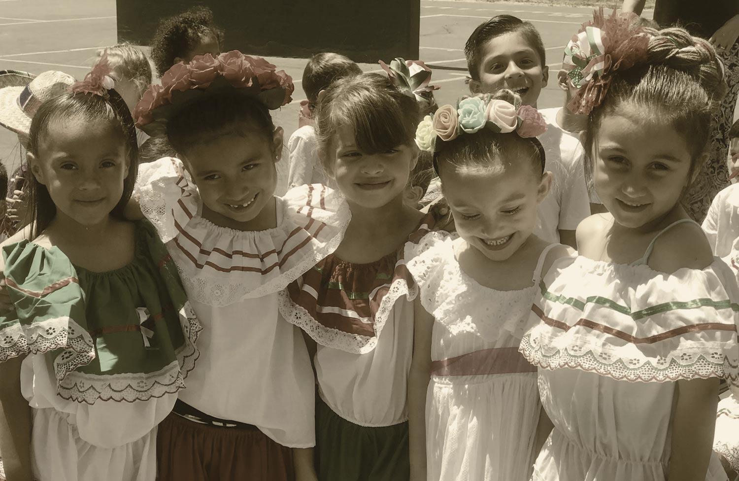 Young Children Dressed in Traditional Hispanic Costumes Smiling