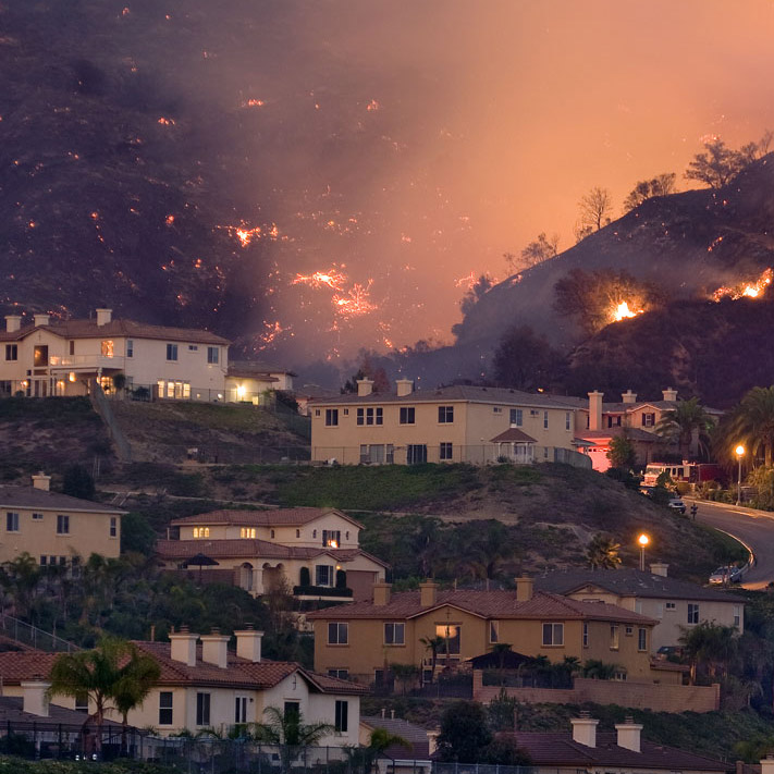 A fire devastating the suburban landscape in Southern California