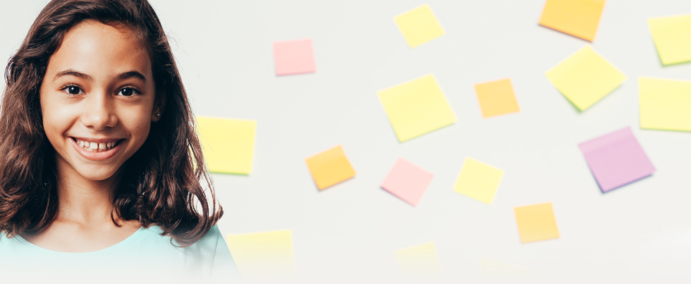 young girl in front of sticky notes