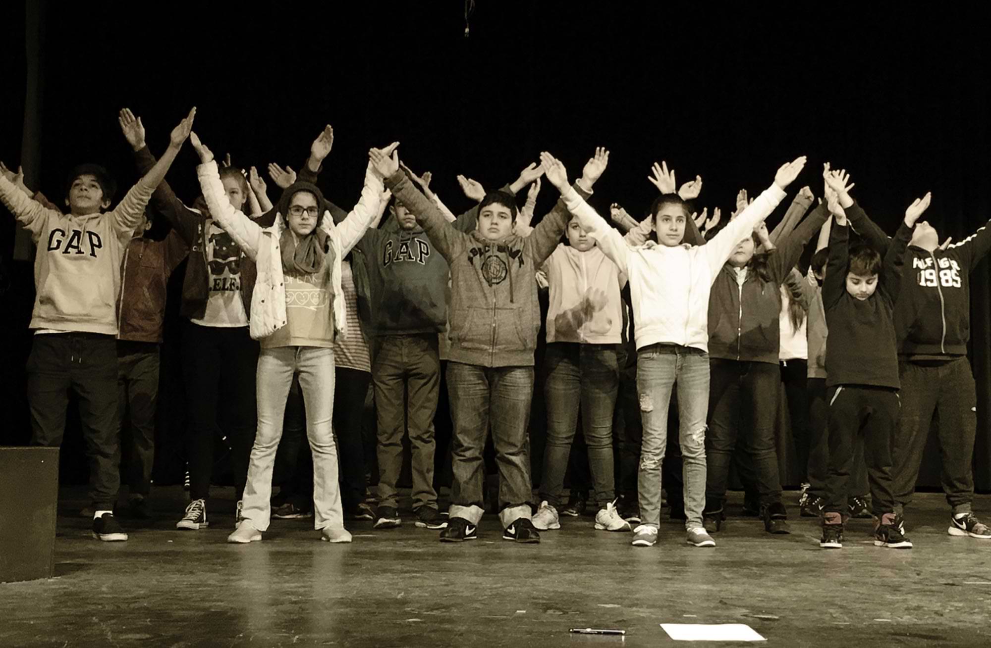 middle school aged children on stage during a performance
