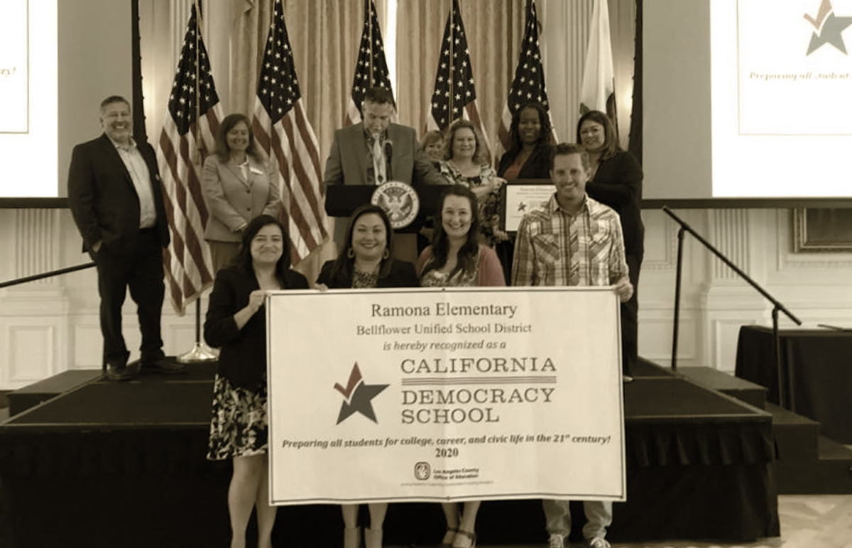 Ramona Elementary Staff Holding a their "California Democracy School"