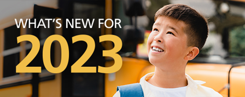 an image of a young boy near a school bus imposed with the words "What's New for 2023"