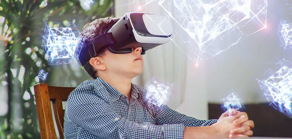 a young boy wears VR goggles while white holographic cubes float around him
