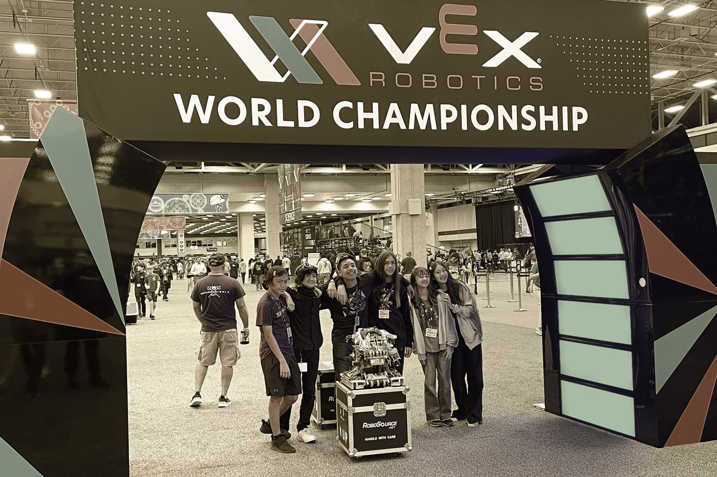 Student members of the Sweetwater Union High School District VEX Robotics League Program take a group photo at the entrance of the VEX Robotics World Championship