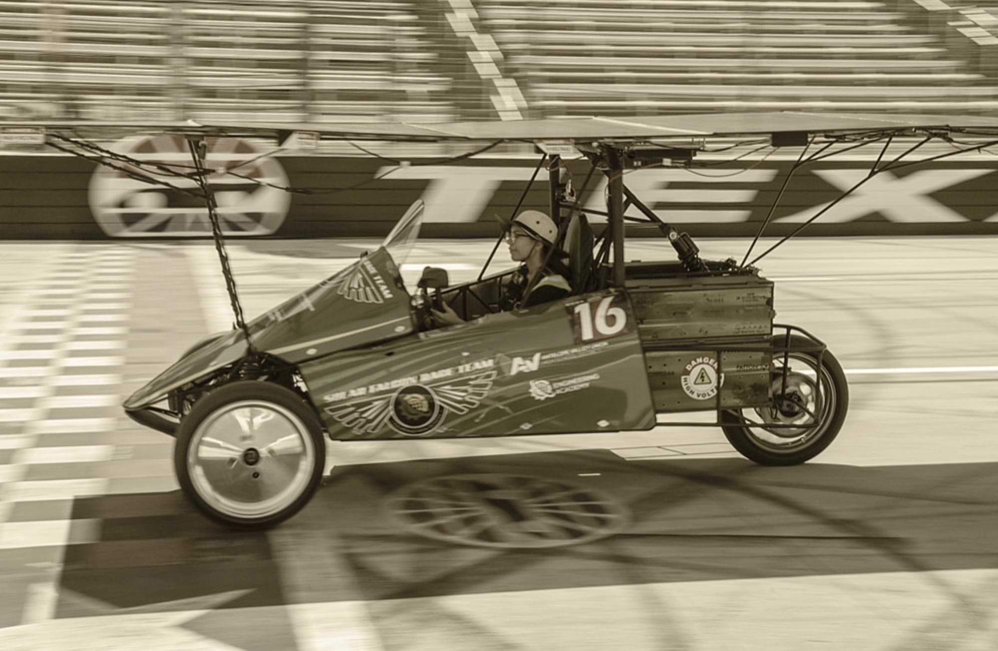 a young Palmdale high school student drives a solar car on a track