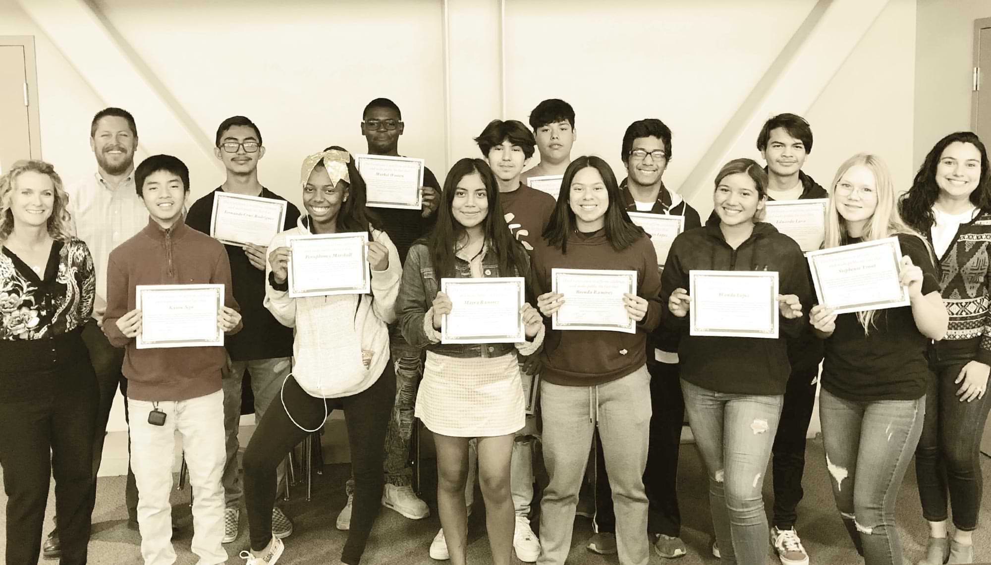 San Bernardino City Unified School District student members of the Undercover Anti-Bullying Team (UABT) take a group photo, each holding a certificate
