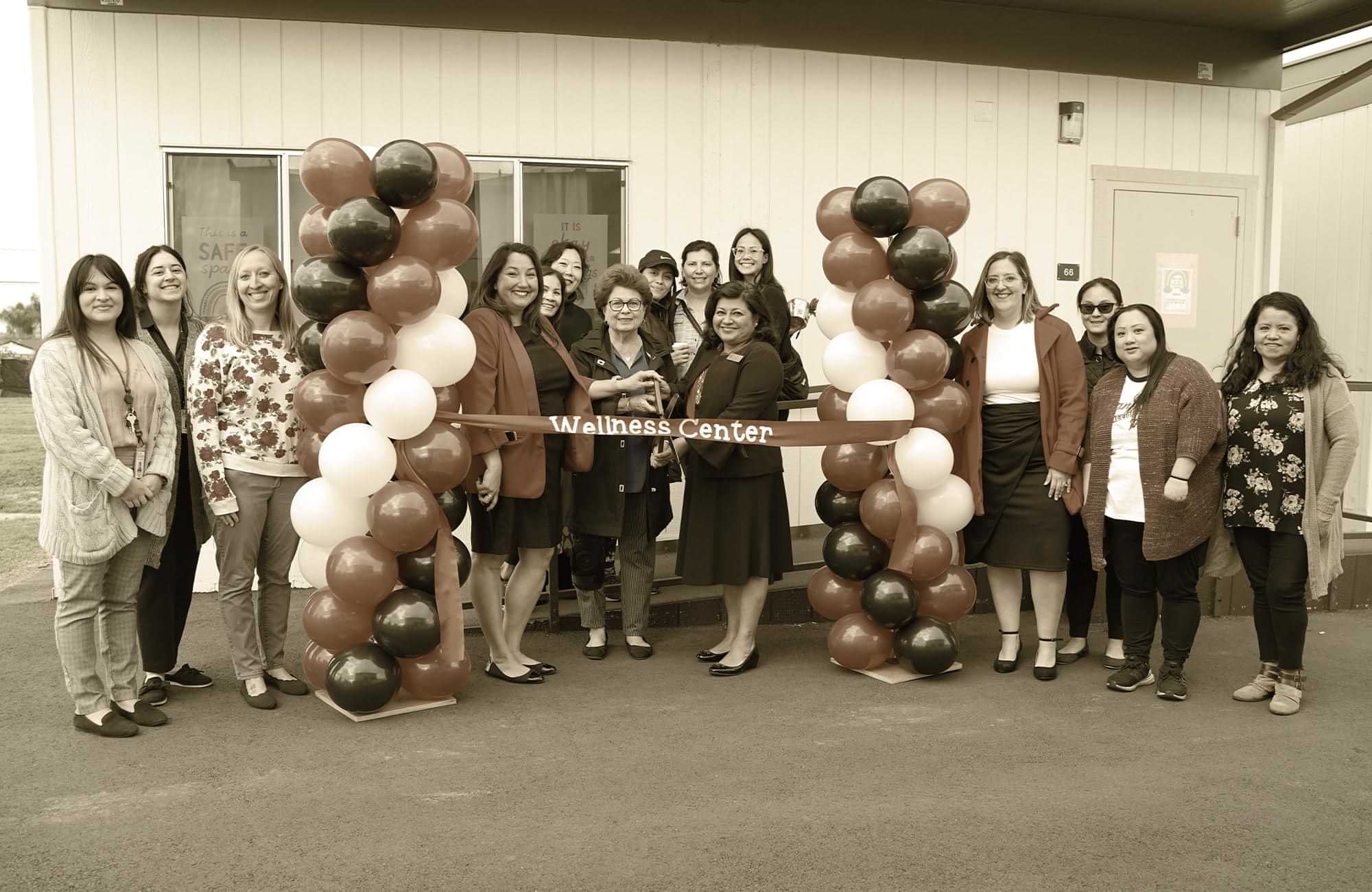 faculty at a Garden Grove Unified School gather for a small ribbon cutting for the ASPIRE System of Care campus wellness center