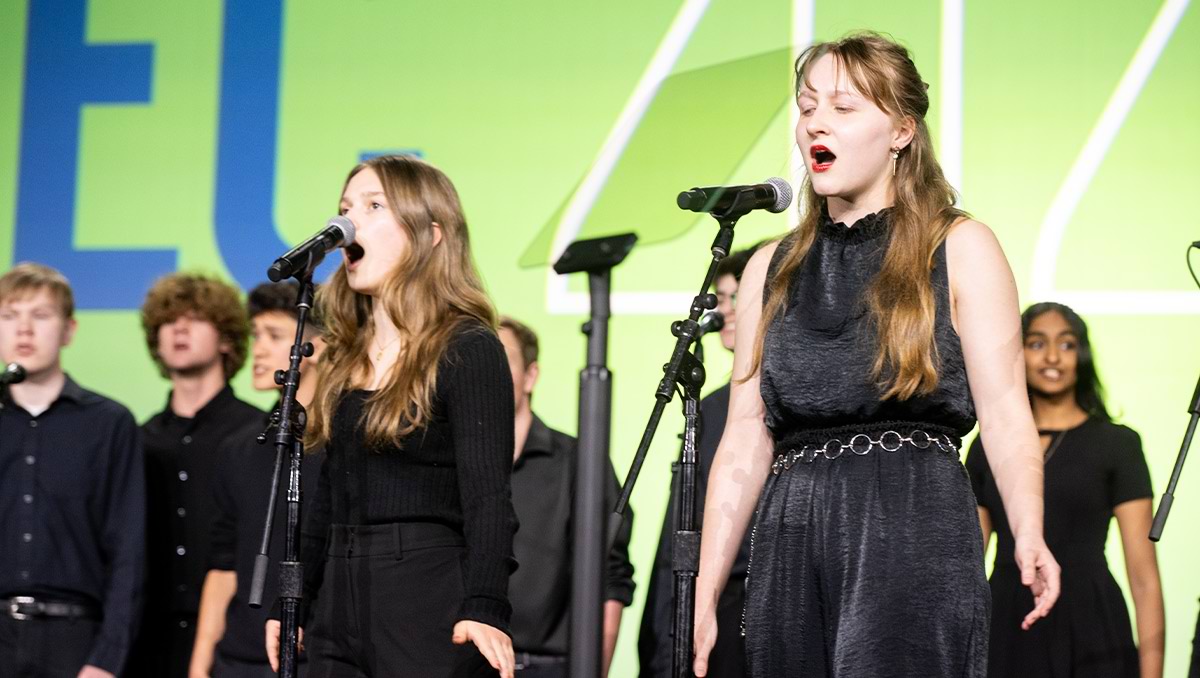 Carlmont Chamber Singers from Sequoia Union HSD, all dressed in black, perform during the Second GS