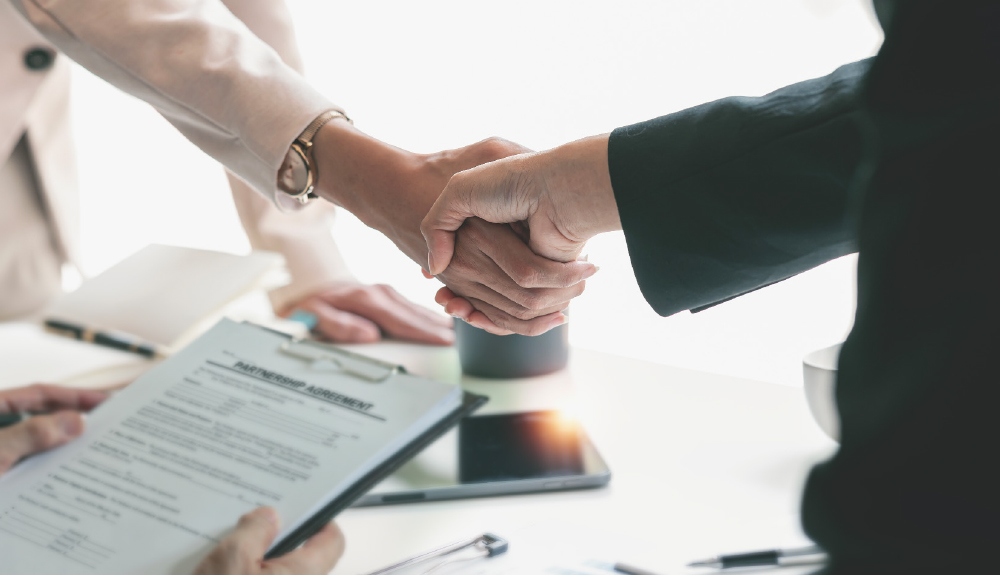 closeup of two people shaking hands