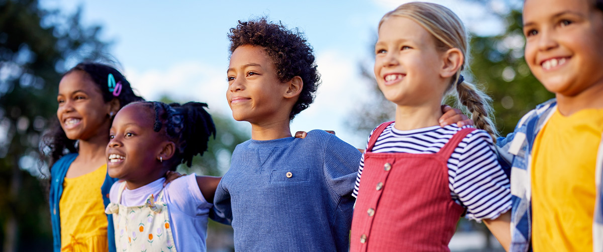 kids standing together in a line outdoors