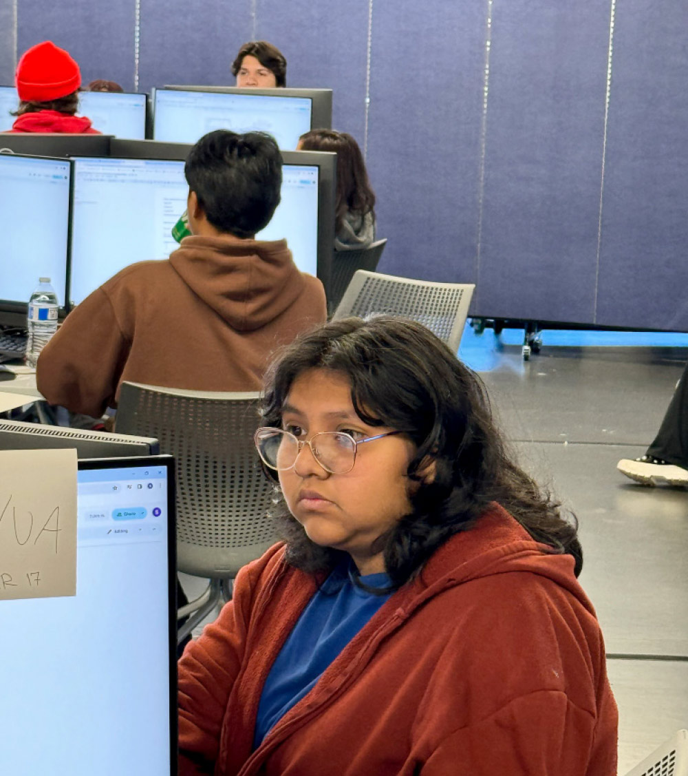 student focused on computer screen