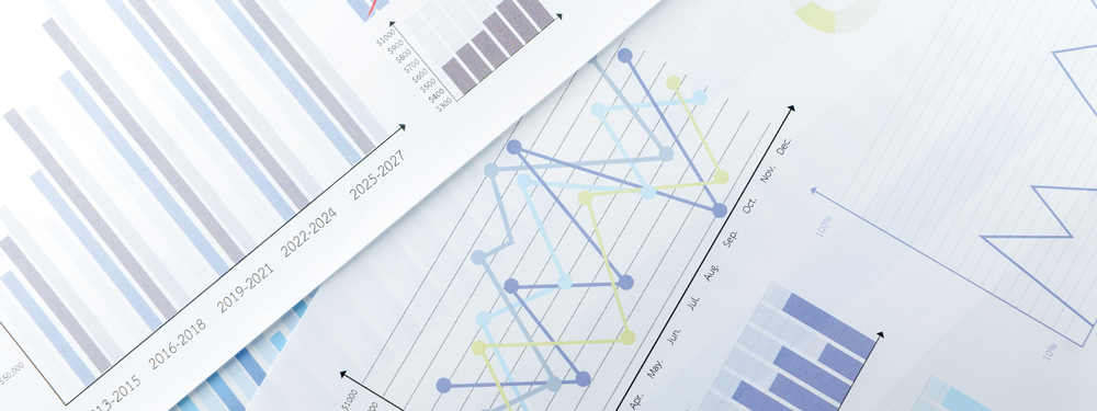Overlapping pages containing line graphs, bar graphs, and pie charts.