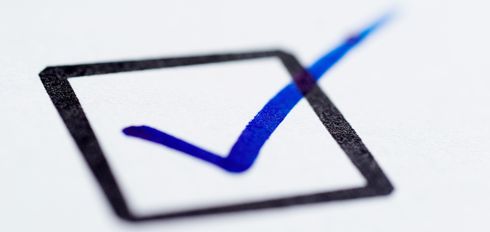close angled view of a black box with a blue marker check mark