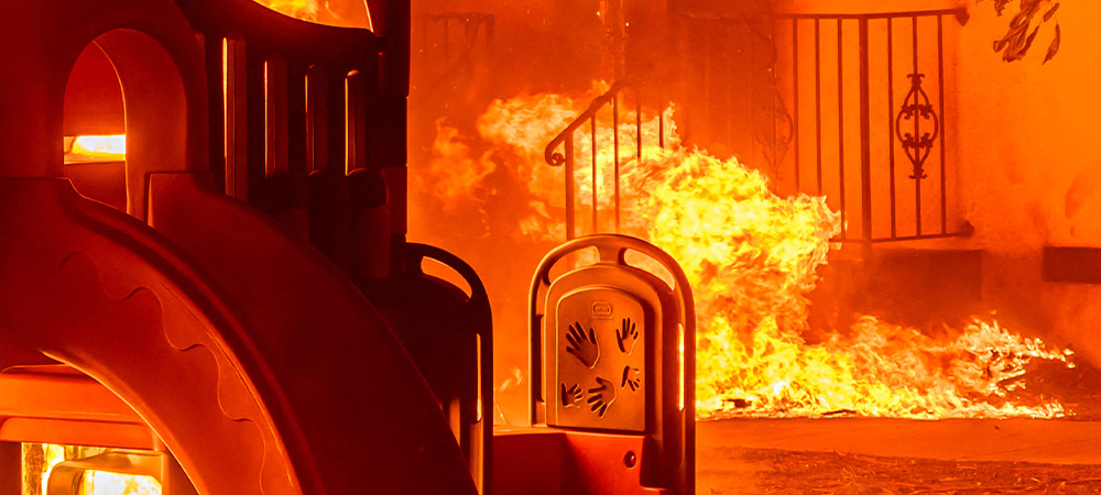 cropped image of a playground engulfed in fire