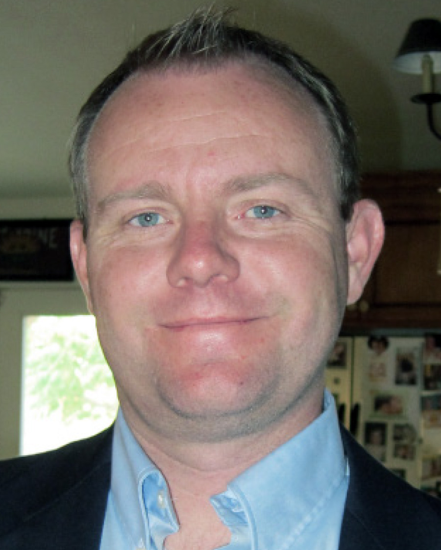 headshot of Chris Claire