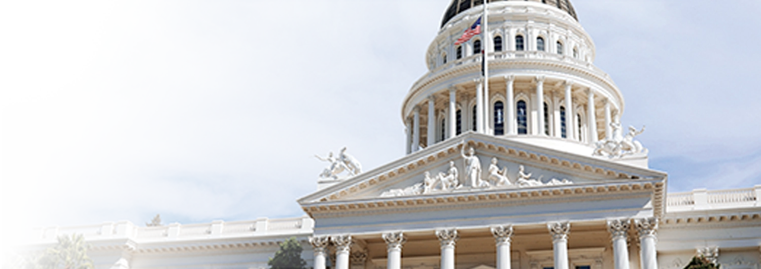 a view of the white domed state capitol building